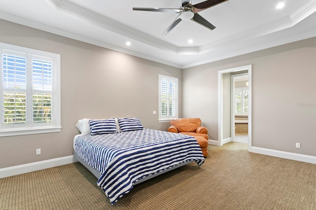 47 Martinique Ave, Tampa, FL 33606 - carpeted bedroom featuring ornamental molding, a tray ceiling, multiple windows, and baseboards