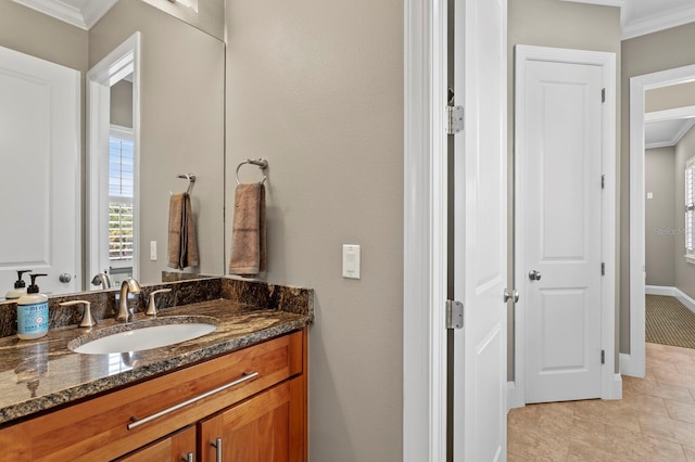 47 Martinique Ave, Tampa, FL 33606 - bathroom featuring tile patterned floors, vanity, crown molding, and baseboards