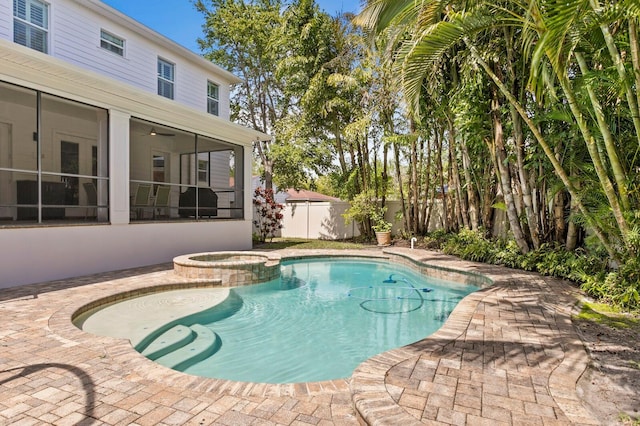 47 Martinique Ave, Tampa, FL 33606 - view of pool with a pool with connected hot tub, a sunroom, fence, and a patio