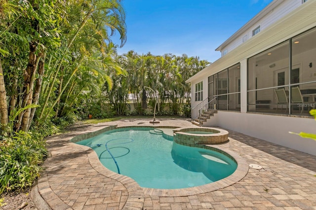 47 Martinique Ave, Tampa, FL 33606 - view of pool with a pool with connected hot tub, a sunroom, and a patio