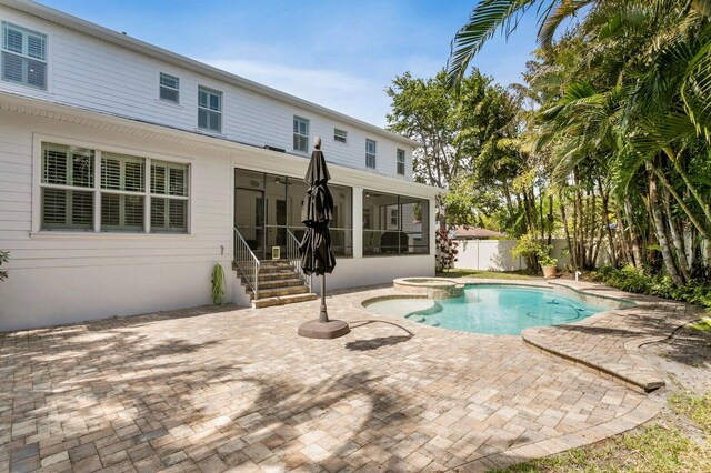 47 Martinique Ave, Tampa, FL 33606 - view of swimming pool featuring a sunroom, fence, an in ground hot tub, and a patio area
