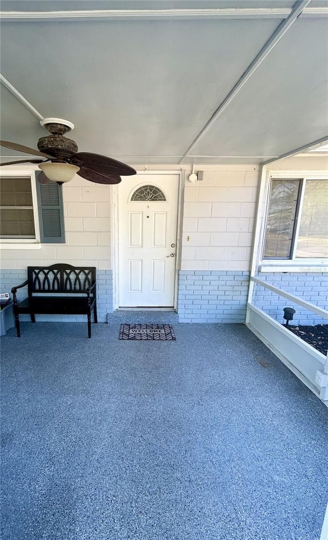 8766 91st St, Seminole, FL 33777 - entrance to property with concrete block siding and ceiling fan