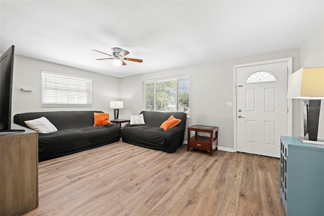 8766 91st St, Seminole, FL 33777 - living area with light wood-style floors, baseboards, and ceiling fan