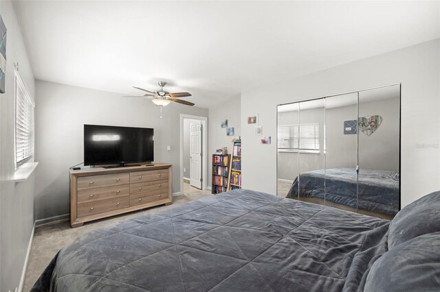 8766 91st St, Seminole, FL 33777 - carpeted bedroom featuring a closet, a ceiling fan, and baseboards