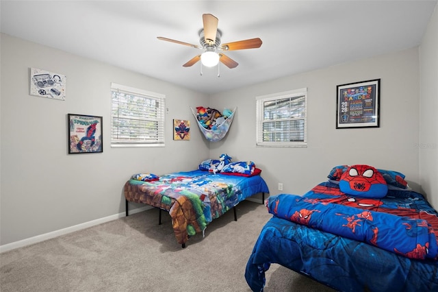 8766 91st St, Seminole, FL 33777 - bedroom with carpet, baseboards, and multiple windows