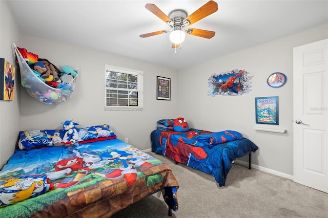 8766 91st St, Seminole, FL 33777 - carpeted bedroom featuring a ceiling fan and baseboards