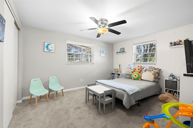 8766 91st St, Seminole, FL 33777 - carpeted bedroom with a ceiling fan and a closet