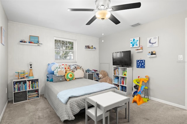 8766 91st St, Seminole, FL 33777 - bedroom featuring baseboards, visible vents, carpet flooring, and ceiling fan