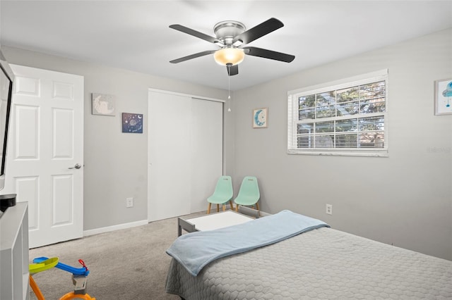 8766 91st St, Seminole, FL 33777 - bedroom with ceiling fan, baseboards, carpet flooring, and a closet
