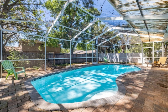 8766 91st St, Seminole, FL 33777 - view of swimming pool featuring a fenced backyard, a patio area, a fenced in pool, and glass enclosure