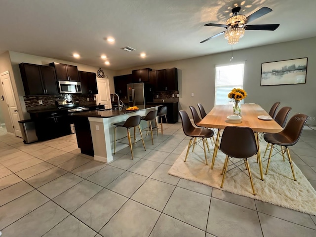 dining room featuring ceiling fan, light tile patterned flooring, visible vents, and recessed lighting