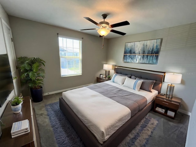 carpeted bedroom with a ceiling fan and baseboards