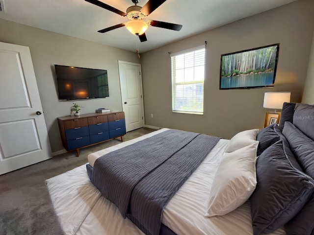bedroom featuring baseboards, visible vents, light colored carpet, and ceiling fan