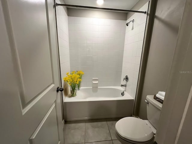 full bath featuring shower / bathtub combination, tile patterned flooring, and toilet