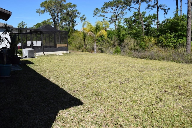 view of yard with central AC unit