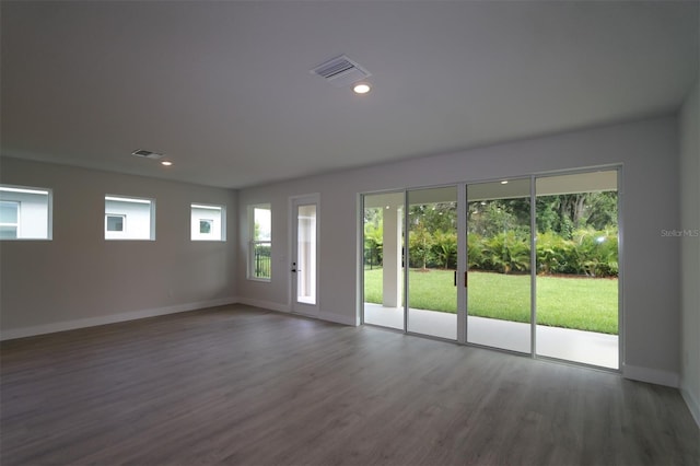 11884 Richmond Trl, Parrish, FL 34219 - empty room with wood finished floors and recessed lighting