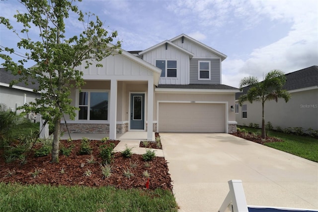 11884 Richmond Trl, Parrish, FL 34219 - craftsman inspired home with stone siding, board and batten siding, driveway, and an attached garage