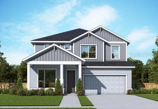 11884 Richmond Trl, Parrish, FL 34219 - view of front of property featuring board and batten siding, concrete driveway, an attached garage, and roof with shingles