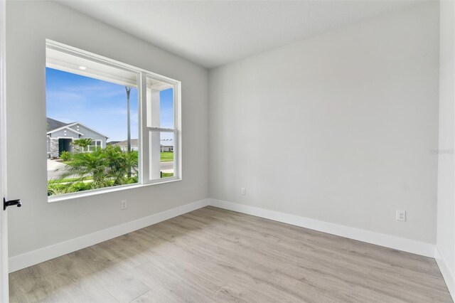 11884 Richmond Trl, Parrish, FL 34219 - unfurnished room featuring wood finished floors