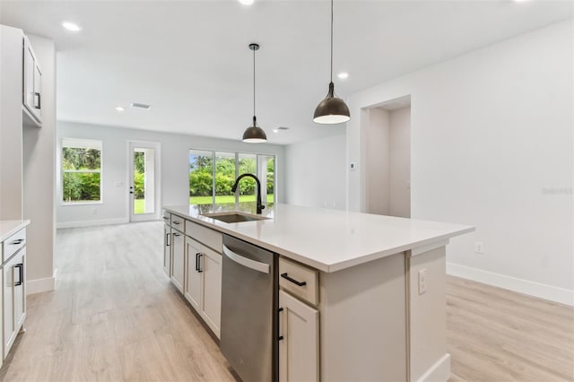 11884 Richmond Trl, Parrish, FL 34219 - kitchen with dishwasher, light wood-type flooring, plenty of natural light, light countertops, and recessed lighting