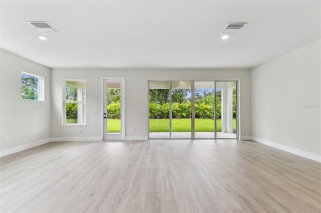 11884 Richmond Trl, Parrish, FL 34219 - empty room with light wood-style floors and recessed lighting