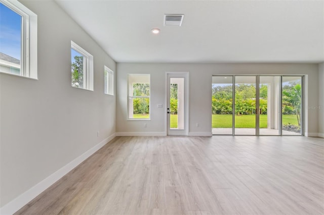11884 Richmond Trl, Parrish, FL 34219 - empty room featuring light wood-style flooring and recessed lighting