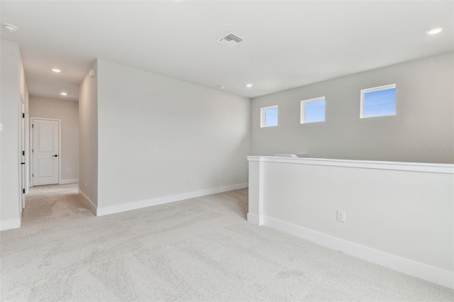 11884 Richmond Trl, Parrish, FL 34219 - empty room featuring light carpet, recessed lighting, and a smoke detector