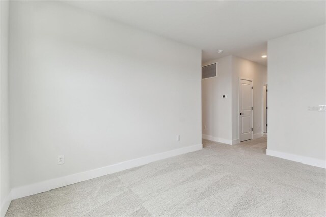 11884 Richmond Trl, Parrish, FL 34219 - empty room featuring light colored carpet and recessed lighting