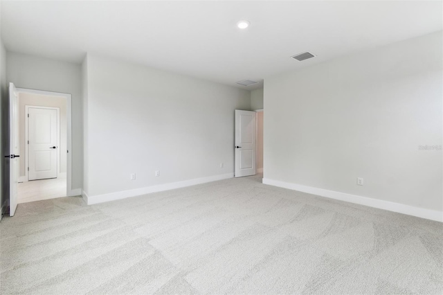 11884 Richmond Trl, Parrish, FL 34219 - unfurnished room featuring light carpet and recessed lighting