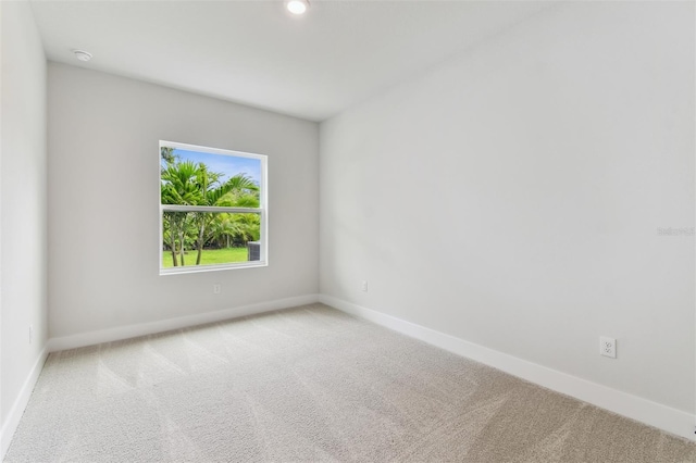 11884 Richmond Trl, Parrish, FL 34219 - unfurnished room featuring carpet floors and a smoke detector