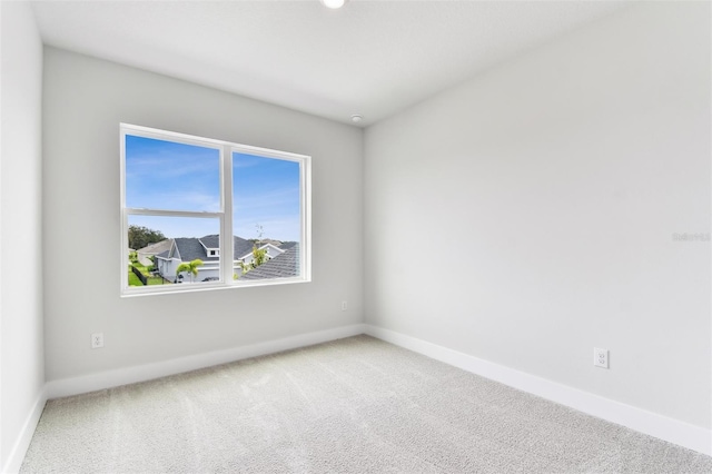 11884 Richmond Trl, Parrish, FL 34219 - carpeted spare room with baseboards