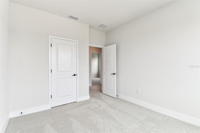 11884 Richmond Trl, Parrish, FL 34219 - unfurnished bedroom featuring carpet flooring and baseboards