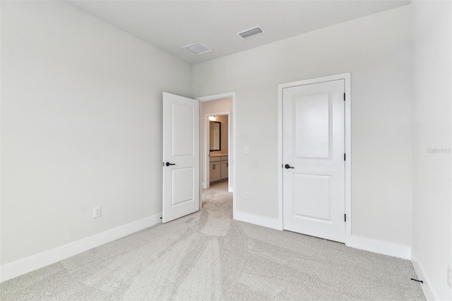 11884 Richmond Trl, Parrish, FL 34219 - unfurnished bedroom featuring light colored carpet and baseboards