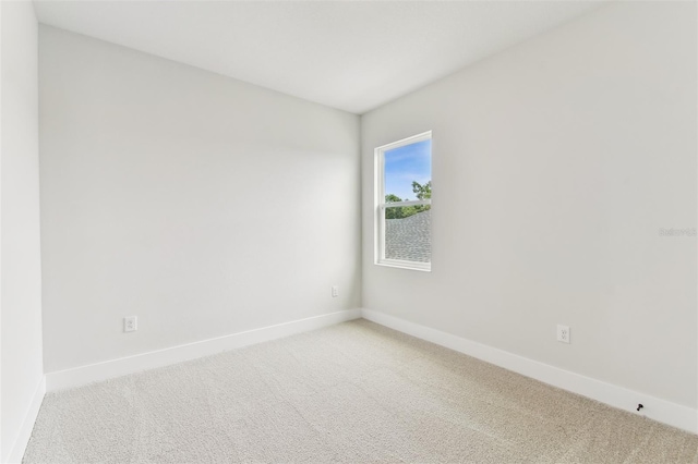 11884 Richmond Trl, Parrish, FL 34219 - empty room with light colored carpet and baseboards