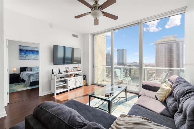 777 N Ashley Dr Unit 2610, Tampa, FL 33602 - living area with visible vents, a wall of windows, baseboards, wood finished floors, and a ceiling fan
