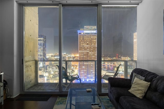 777 N Ashley Dr Unit 2610, Tampa, FL 33602 - living room with a city view, a wall of windows, and wood finished floors