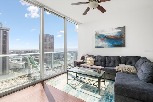 777 N Ashley Dr Unit 2610, Tampa, FL 33602 - living room with a ceiling fan, wood finished floors, a wall of windows, and a city view