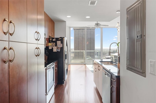 777 N Ashley Dr Unit 2610, Tampa, FL 33602 - kitchen featuring a sink, ceiling fan, dishwasher, visible vents, and wood finished floors