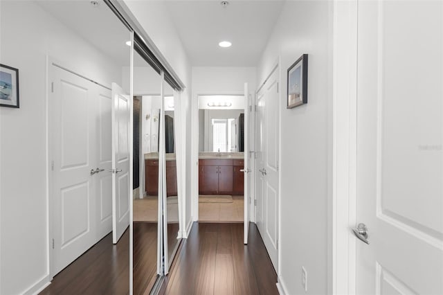 777 N Ashley Dr Unit 2610, Tampa, FL 33602 - hall with a sink, dark wood-type flooring, and recessed lighting