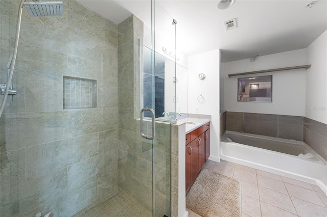777 N Ashley Dr Unit 2610, Tampa, FL 33602 - full bath with a bath, visible vents, a shower stall, tile patterned floors, and vanity