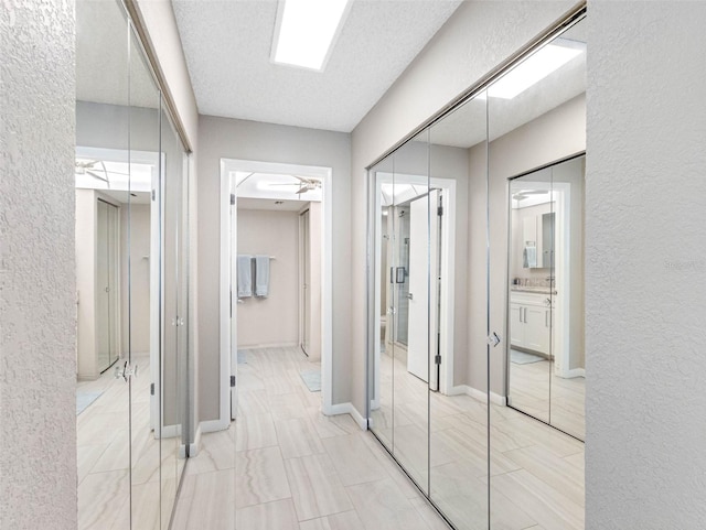 hall with a textured wall