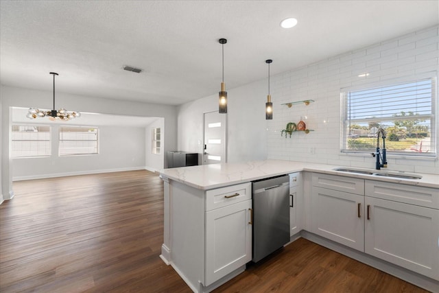 331 Barbara Cir, Belleair, FL 33756 - kitchen with stainless steel dishwasher, a sink, a peninsula, plenty of natural light, and recessed lighting