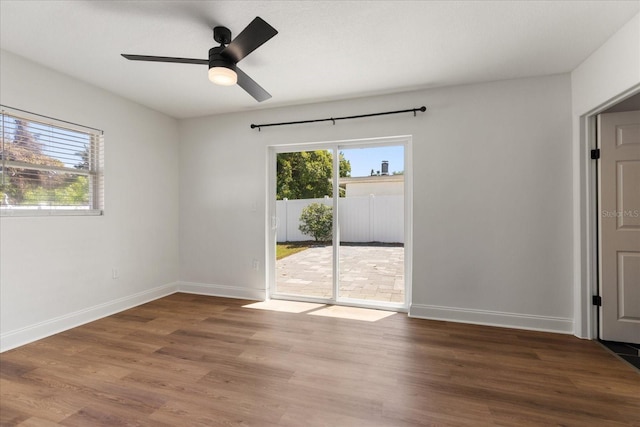 331 Barbara Cir, Belleair, FL 33756 - unfurnished room featuring baseboards, wood finished floors, and a ceiling fan