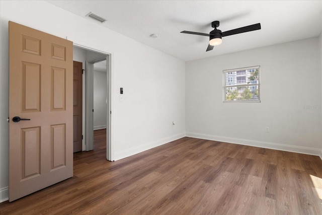 331 Barbara Cir, Belleair, FL 33756 - unfurnished room with wood finished floors, baseboards, and ceiling fan