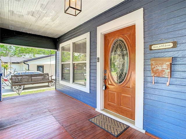 doorway to property featuring a porch