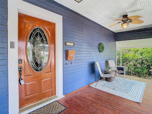 entrance to property featuring ceiling fan