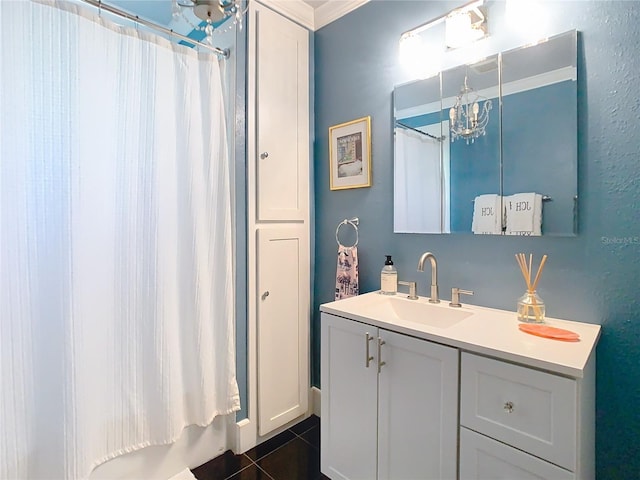 bathroom featuring tile patterned floors, a shower with shower curtain, vanity, and an inviting chandelier