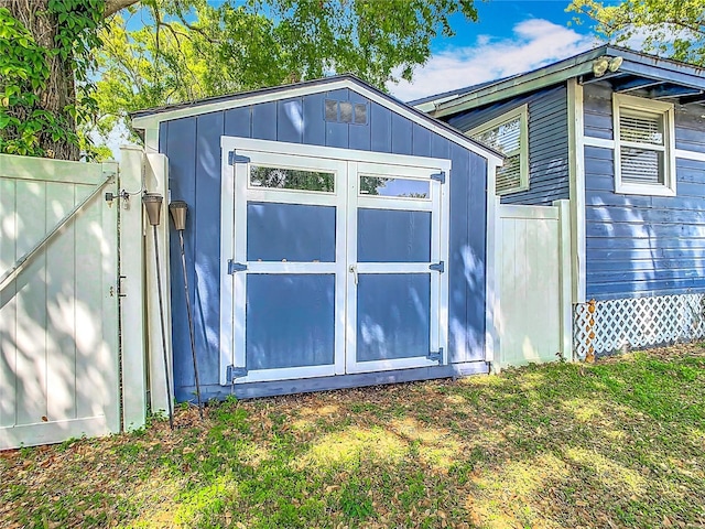 view of shed with fence