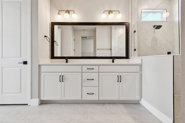bathroom with a walk in shower, tile patterned flooring, a sink, and double vanity