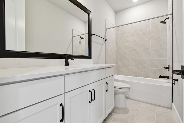 bathroom featuring toilet, shower / bathtub combination, vanity, and tile patterned floors